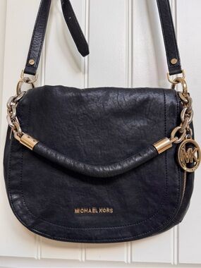 Michael Kors Bedford Flap Black Leather shoulder bag. 12” by 10” by 1”